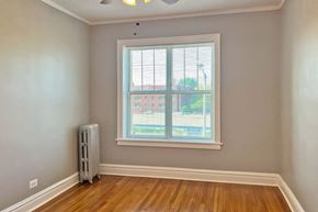 Oak Park apartment for rent - A room with a window and a radiator on the floor.