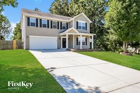 High Point house for rent - a house with a white driveway in front of it