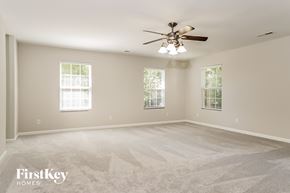 High Point house for rent - the master bedroom is spacious and clean with a ceiling fan