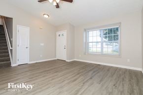Lebanon house for rent - A spacious room with a staircase on the left and a window on the right.