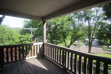 Pittsburgh apartment for rent - a porch with a view of trees and a street