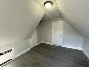 Magnolia apartment for rent - A room with a white door and a window in the ceiling.