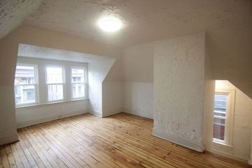 Pittsburgh apartment for rent - an empty living room with wood floors and white walls