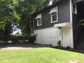 Tulsa house for rent - a white garage door on the side of a house