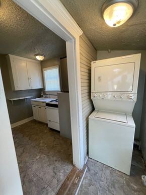 Tulsa house for rent - an empty kitchen with a washer and dryer in it