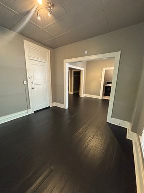 Tulsa apartment for rent - A room with a white door and a white wall.