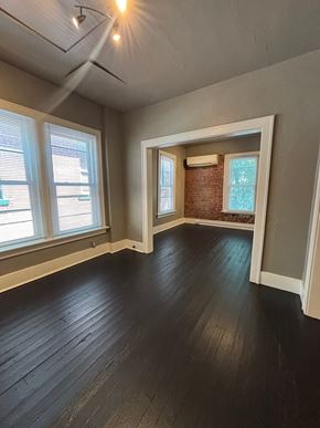 Tulsa apartment for rent - A room with wooden floors and a window.