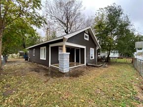 Tulsa house for rent - the front of a house with a garage and a porch