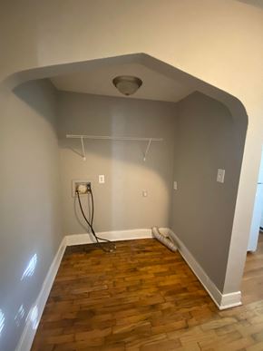 Tulsa house for rent - the living room is being remodeled with wood floors and a ceiling fan