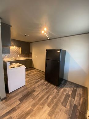 Tulsa apartment for rent - a kitchen with a refrigerator and a stove in a room