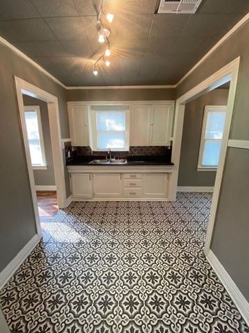 Tulsa house for rent - a kitchen with a sink and a window