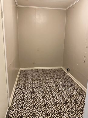 Tulsa house for rent - a small room with a tiled floor and a white wall