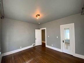 Tulsa house for rent - a empty room with a door and a light on the ceiling