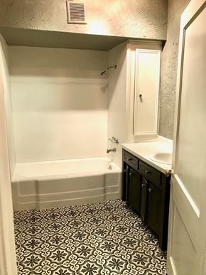 Tulsa house for rent - a small bathroom with a sink and a bath tub