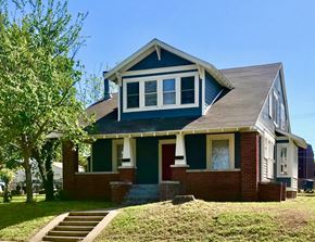 Tulsa house for rent - a house with a tree in front of it