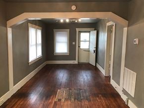 Tulsa house for rent - a living room with a hard wood floor and grey walls