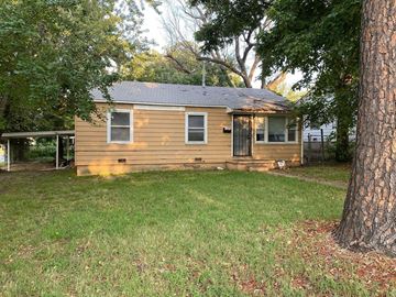 Tulsa house for rent - a small yellow house with a yard and trees