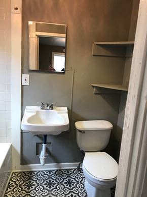 Tulsa house for rent - a small bathroom with a toilet and a sink