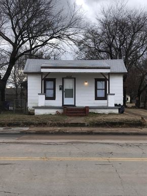 Tulsa house for rent - a small white house on the side of the street