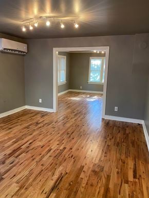 Tulsa house for rent - a living room with a hard wood floor and gray walls
