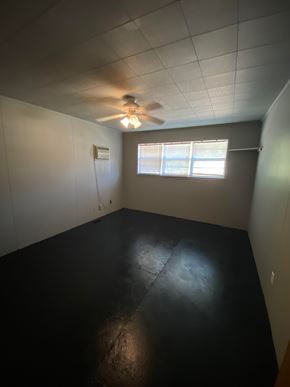 Tulsa house for rent - A room with a ceiling fan and a window.