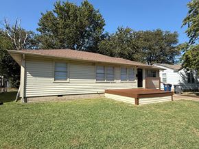 Tulsa house for rent - A house with a brown roof and a porch.