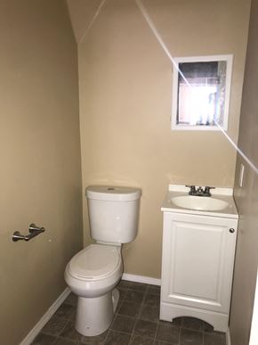Tulsa house for rent - a small bathroom with a toilet and a sink