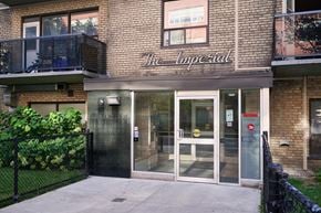 Toronto apartment for rent - The Imperial building has a black fence in front of it.