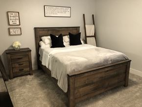 Odessa apartment for rent - a bedroom with a bed with a white comforter and black pillows