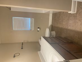Leesville house for rent - a bathroom with a toilet and a sink and a window