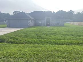 Leesville house for rent - a yard in front of a house with grass