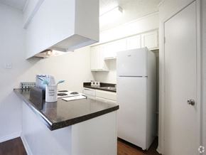 Baton Rouge apartment for rent - a kitchen with a counter top and a refrigerator
