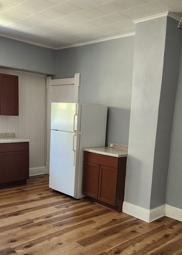 Clinton apartment for rent - a small kitchen with a refrigerator and a sink