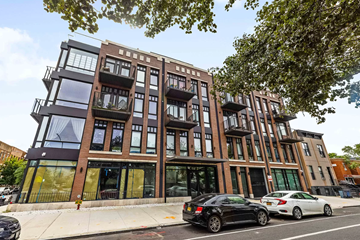 Brooklyn apartment for rent - a condo building on a city street with cars parked