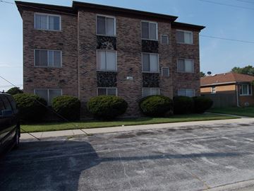 Calumet City apartment for rent - an apartment building with a car parked in front of it