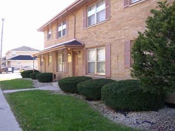 Lansing apartment for rent - a building with a sidewalk in front of it