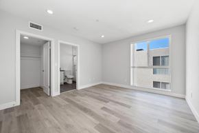Los Angeles apartment for rent - a living room with a large window and a door to a bathroom