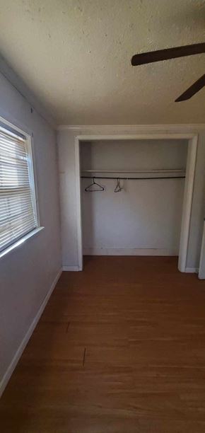 Carson house for rent - an empty room with a wooden floor and a window
