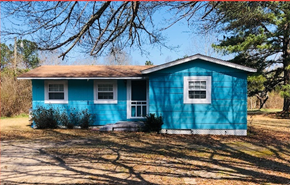 Carson house for rent - a blue house with a tree in front of it