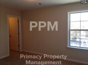 Blythewood house for rent - an empty room with a window and a door