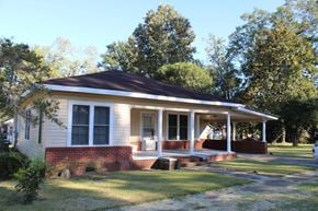 New Hebron house for rent - A small house with a porch and a covered front door.