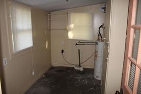 New Hebron house for rent - A room with a white wall and a window with blinds.