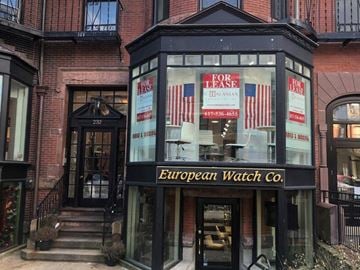 Boston apartment for rent - the front of a store with a window with chairs in it