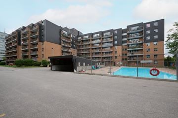Scarborough apartment for rent - A large apartment complex with a pool in the foreground.