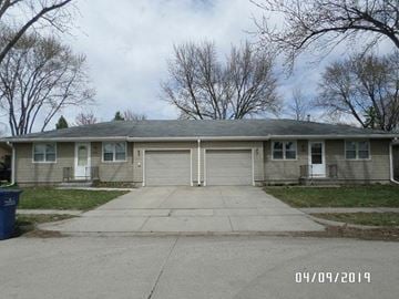 Fremont apartment for rent - A house with a grey roof and a white door is shown.
