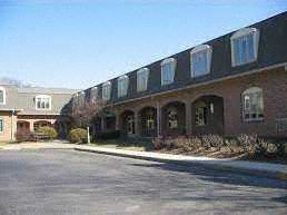 Marietta apartment for rent - a large brick building with windows and a street