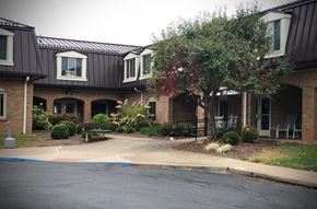 Marietta apartment for rent - a street in front of a brick house with a sidewalk
