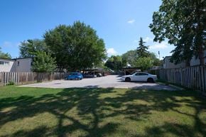 Oakville apartment for rent - A blue car is parked in a driveway.