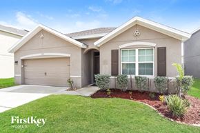 Rockledge house for rent - A house with a garage and a window is for sale.