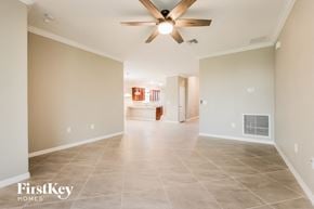 Babcock Ranch house for rent - the spacious living room with tile flooring and a ceiling fan